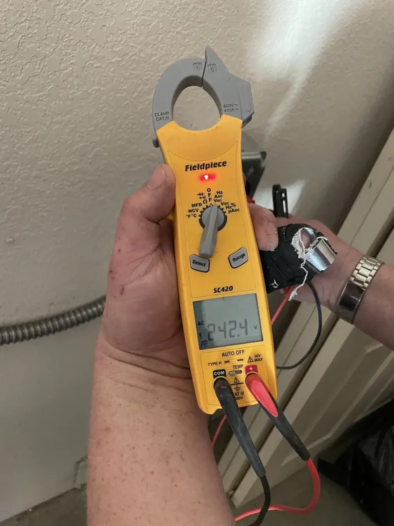 Voltage testing with clamp meter during Generator Installation in Silver Firs